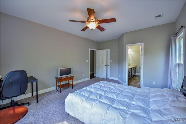 4401 Nicholas Ave, Northport, AL 35473 - bedroom featuring carpet, baseboards, ceiling fan, and ensuite bathroom