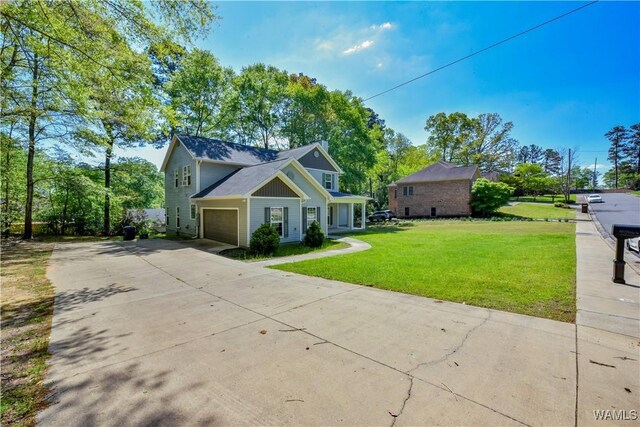 4401 Nicholas Ave, Northport, AL 35473 - view of front of property featuring concrete driveway and a front lawn