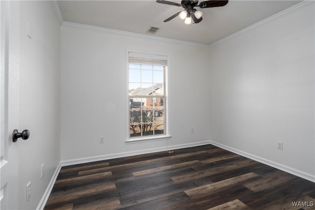 empty room with ornamental molding, ceiling fan, and dark wood-type flooring