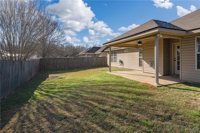 view of yard featuring ceiling fan and a patio area