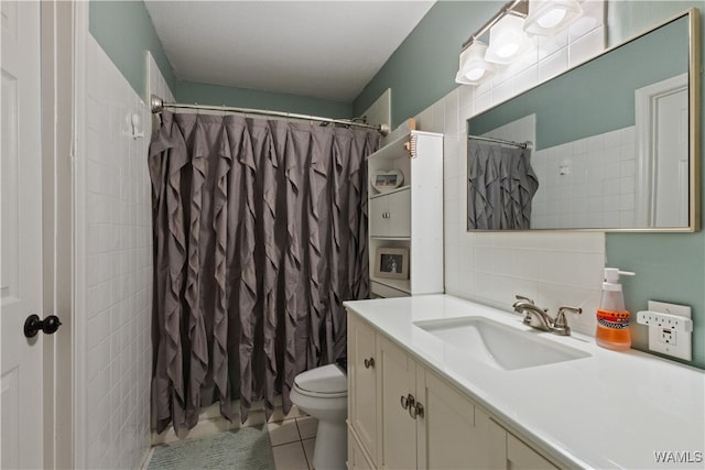 bathroom with vanity, tile patterned floors, toilet, tasteful backsplash, and curtained shower