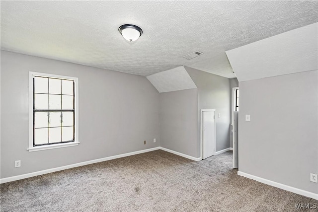 1924 Still Oaks Dr, Montgomery, AL 36117 - bonus room with carpet flooring, a textured ceiling, and vaulted ceiling