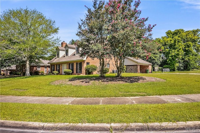 1924 Still Oaks Dr, Montgomery, AL 36117 - view of front of property featuring a chimney, brick siding, and a front yard