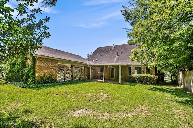 1924 Still Oaks Dr, Montgomery, AL 36117 - rear view of house with brick siding and a patio area
