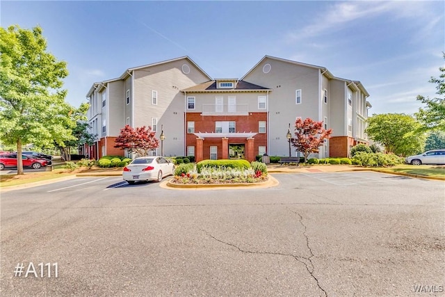 303 Helen Keller Blvd Unit A111, Tuscaloosa, AL 35404 - view of property featuring uncovered parking