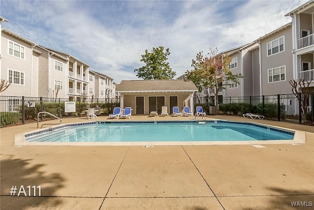 303 Helen Keller Blvd Unit A111, Tuscaloosa, AL 35404 - community pool featuring a patio and a residential view