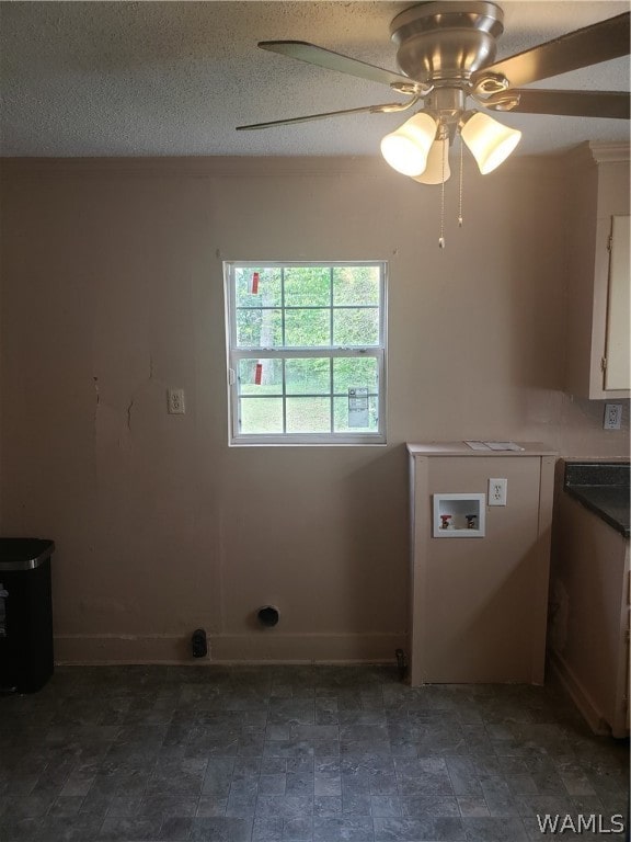 washroom with hookup for a washing machine, a textured ceiling, and ceiling fan