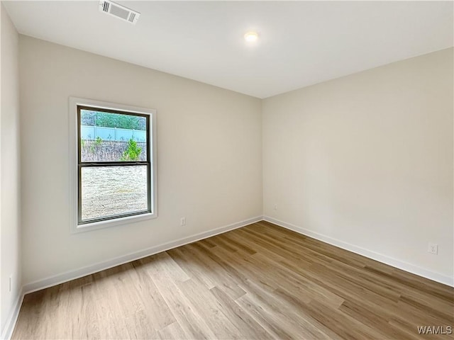 13879 Gilliam Rd, Berry, AL 35546 - empty room with light wood finished floors and baseboards