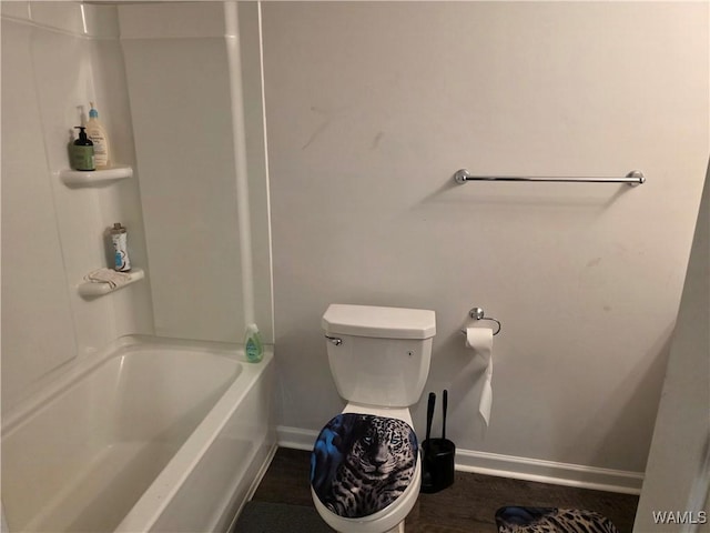 12376 Choctaw Cir, Moundville, AL 35474 - bathroom featuring baseboards, bathtub / shower combination, and toilet