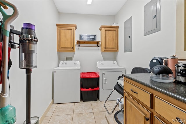 laundry room with cabinets, independent washer and dryer, electric panel, and light tile patterned floors