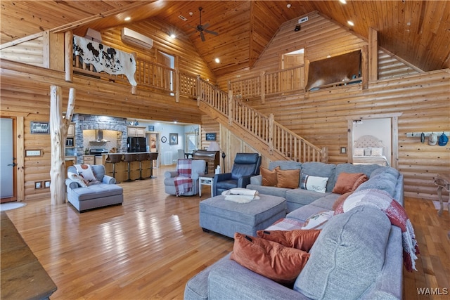 living room with wood-type flooring, high vaulted ceiling, wooden ceiling, and a wall unit AC