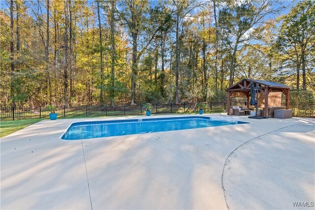 view of swimming pool featuring a gazebo