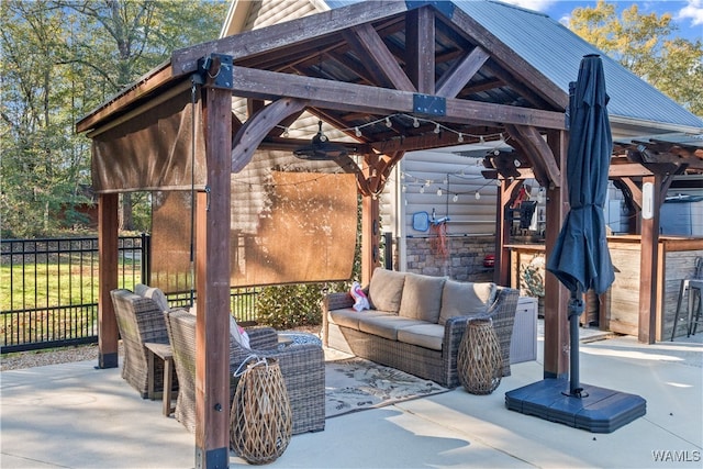 view of patio featuring a gazebo and an outdoor hangout area