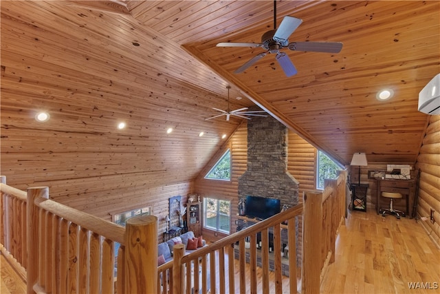 corridor featuring lofted ceiling, wood ceiling, log walls, and light hardwood / wood-style flooring