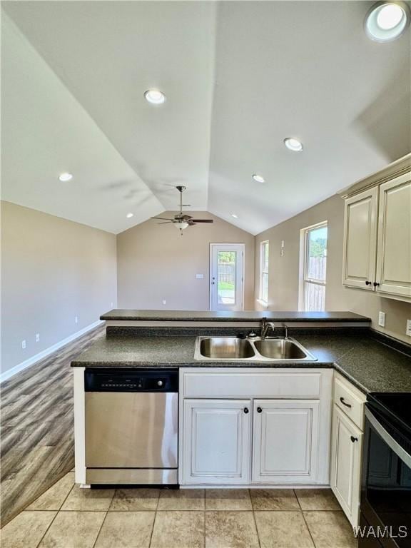 192 Roscommon Rd, Tuscaloosa, AL 35405 - kitchen with dishwasher, a sink, a ceiling fan, dark countertops, and lofted ceiling