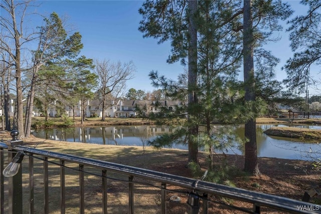 property view of water featuring fence