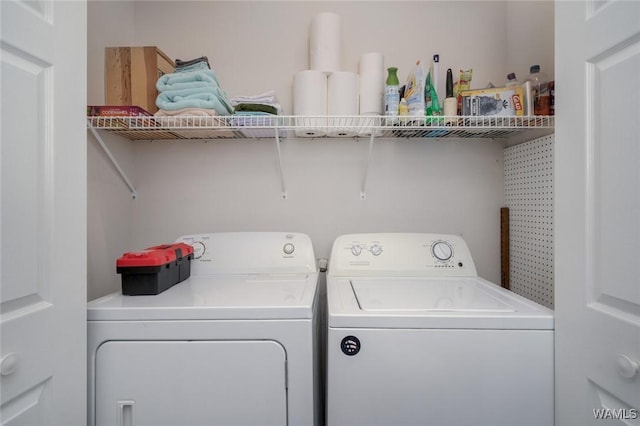 clothes washing area with laundry area and washing machine and clothes dryer