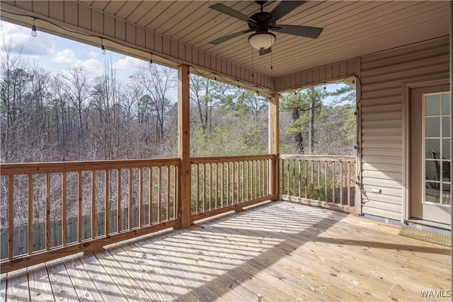 wooden terrace featuring ceiling fan