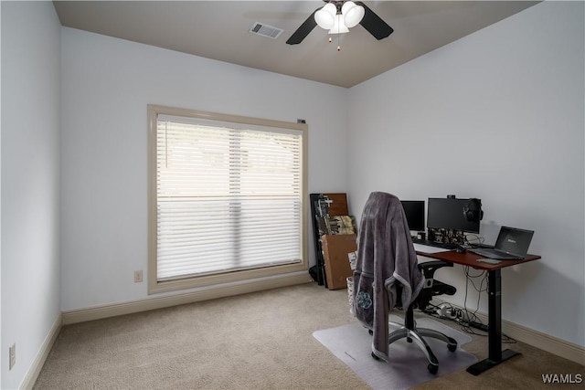 home office featuring ceiling fan and light colored carpet