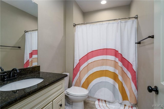 bathroom with vanity and toilet