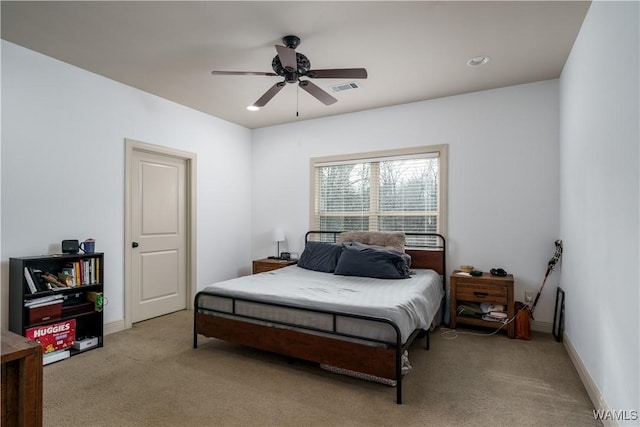 carpeted bedroom with ceiling fan