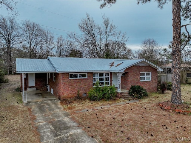 ranch-style house featuring a carport