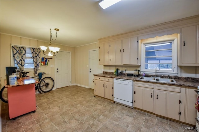 kitchen with pendant lighting, sink, white cabinetry, white dishwasher, and a healthy amount of sunlight