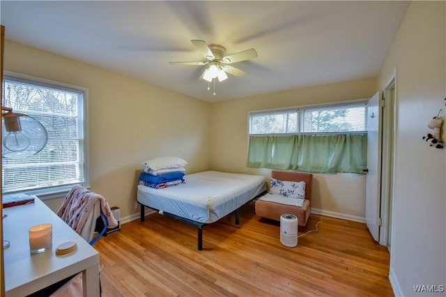 bedroom featuring ceiling fan and light wood-type flooring