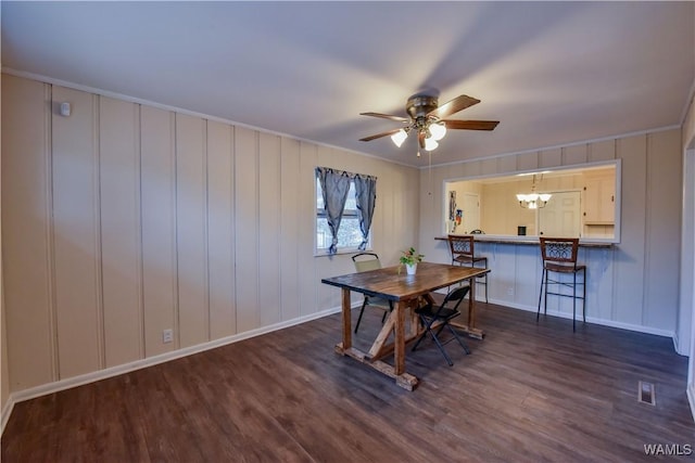 dining space featuring dark wood-type flooring and ceiling fan