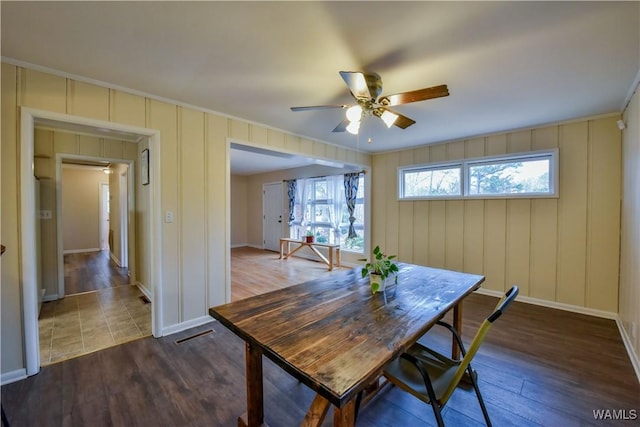 dining area featuring hardwood / wood-style floors, ornamental molding, and ceiling fan