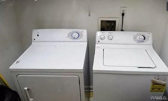 clothes washing area with independent washer and dryer