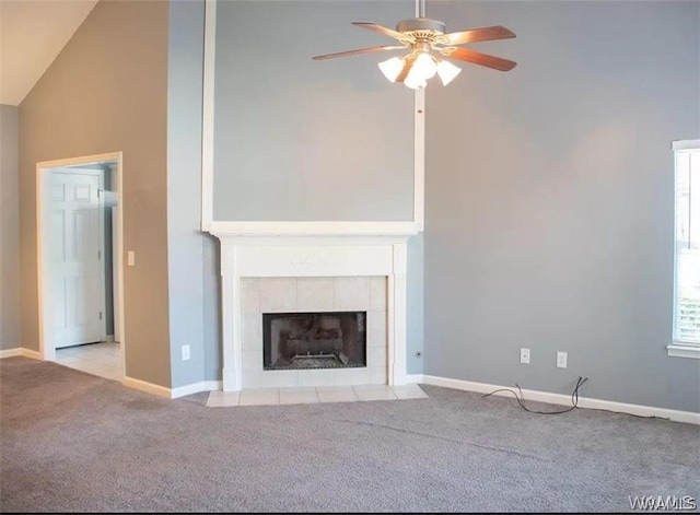 unfurnished living room featuring light carpet, plenty of natural light, and ceiling fan