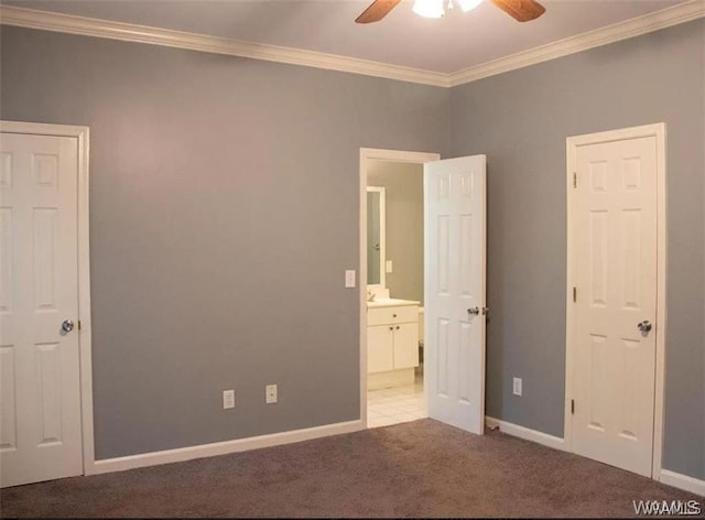 unfurnished bedroom featuring ceiling fan, crown molding, and light carpet