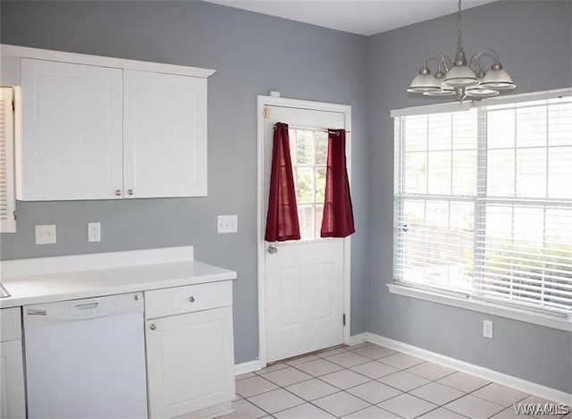 kitchen with white cabinets, white dishwasher, and hanging light fixtures