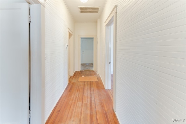 corridor with light wood-type flooring