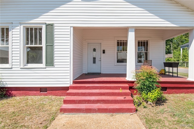 entrance to property with a porch