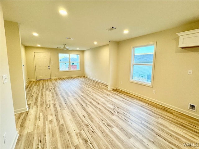 interior space featuring recessed lighting, visible vents, baseboards, and light wood-style floors