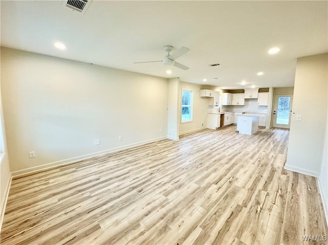 unfurnished living room featuring recessed lighting, visible vents, and light wood-style flooring