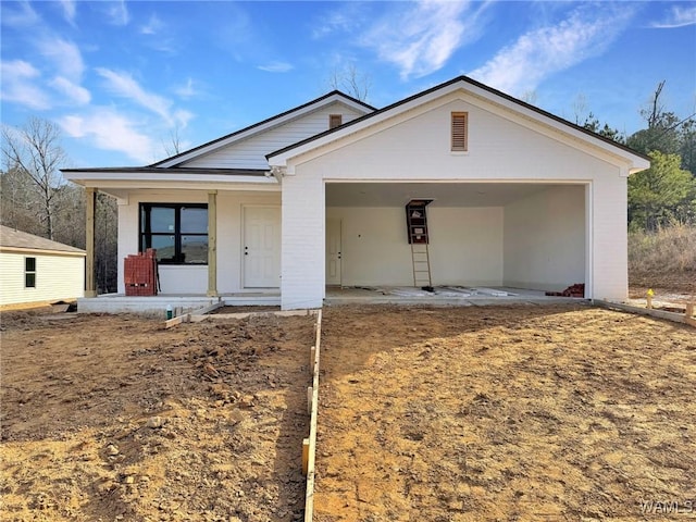 view of front of home with an attached garage and covered porch