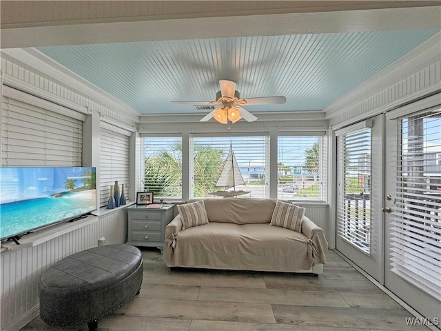 sunroom with a wealth of natural light and ceiling fan