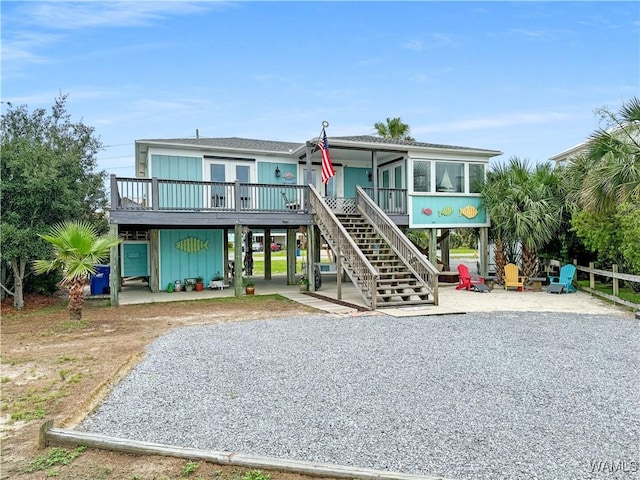 view of play area featuring stairway and a patio area