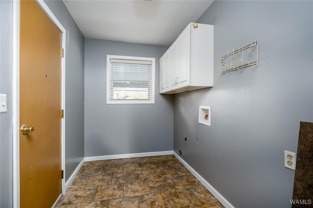 laundry room featuring washer hookup, stone finish floor, cabinet space, baseboards, and hookup for an electric dryer