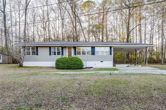 view of front of property with crawl space, an attached carport, metal roof, and driveway