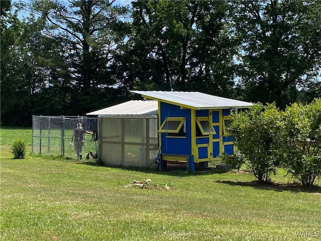 view of outbuilding with an outbuilding and fence