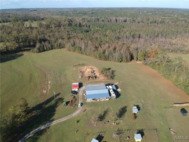 drone / aerial view featuring a view of trees