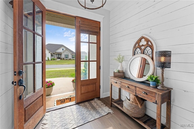 13880 Glenview Dr, Northport, AL 35475 - foyer entrance with wood finished floors, wooden walls, and french doors