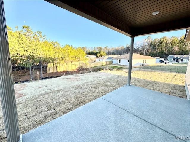 view of patio featuring fence