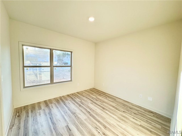 empty room with light wood-style flooring