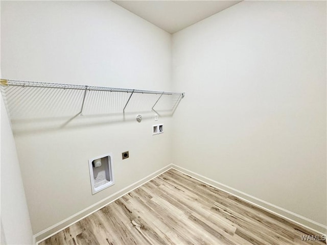 laundry room featuring light wood-style flooring, baseboards, hookup for an electric dryer, hookup for a washing machine, and laundry area