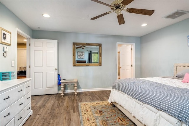 bedroom with ceiling fan and dark hardwood / wood-style floors